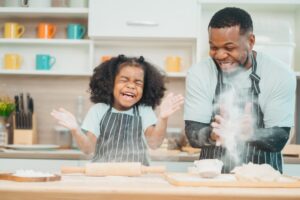 a young girl enjoying spending father's day with her dad