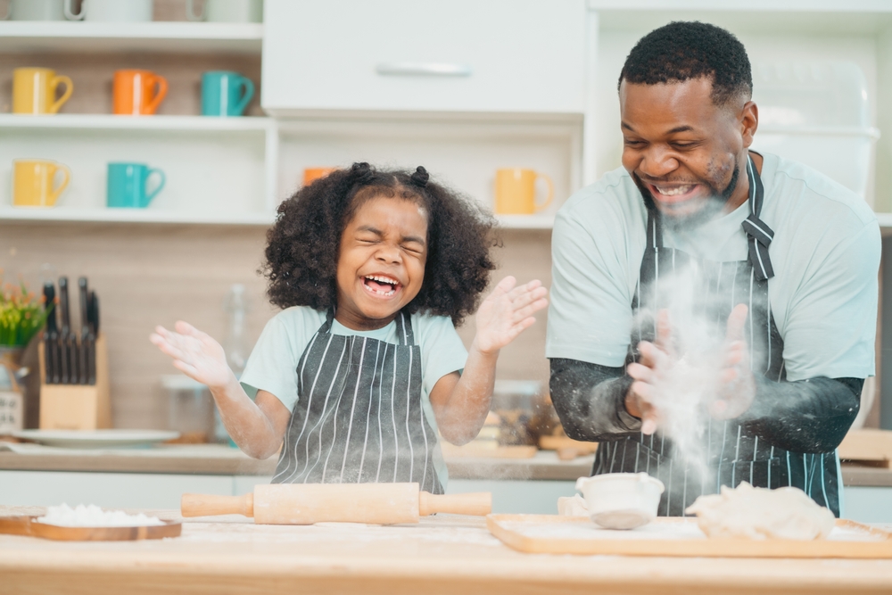 a young girl enjoying spending father's day with her dad